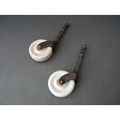 Set of 2 Antique Porcelain Wheel Casters