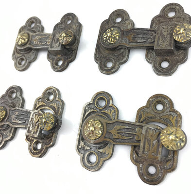 Antique Set of Four Aesthetic Style Ornate Cast Iron and Brass Shutter Bars