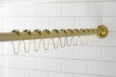 Kingston Brass KSR607 Edenscape 60"-72" Stainless Steel Adjustable Tension Shower Curtain Rod with Rings - Brushed Brass